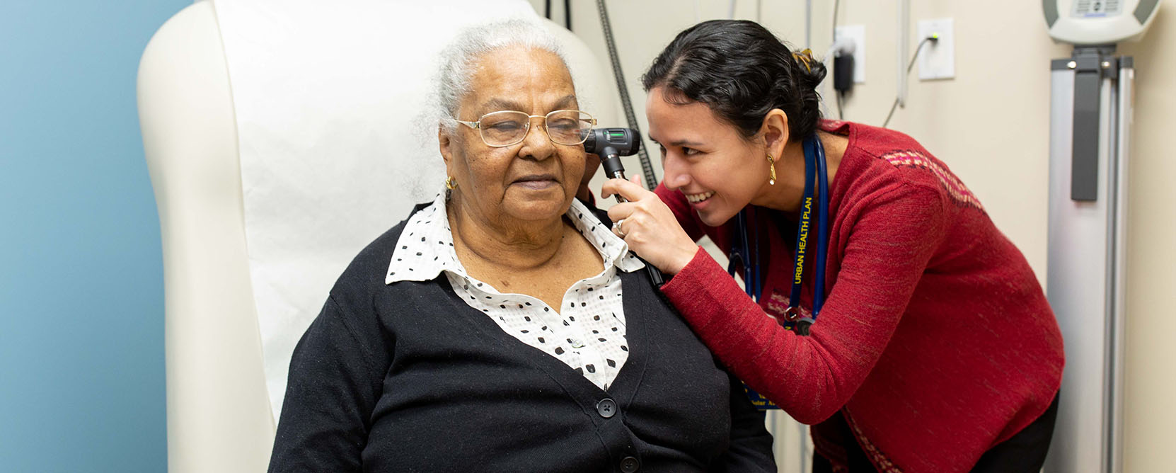 Older adult patient has her ears examined