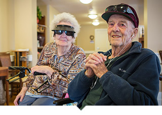 Older adult couple smile for camera