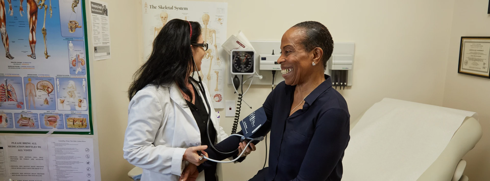 A doctor from South of Market Health Center in San Francisco treats a patient in their new building, which Capital Impact Partners helped to fund.