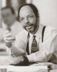 Black and white image of Terry Simonette in conversation