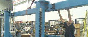 isthmus workers assemble beam courtesy Isthmus Engineering and Manufacturing_blog