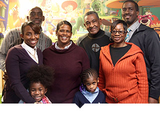 Minority cooperative business owners stand for group photo