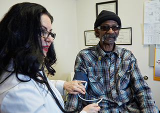 Adult male is examined by a doctor