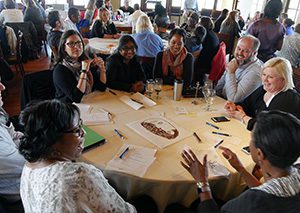 Capital Impact staff working on team building project