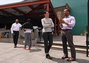 Two Capital Impact colleagues speaking outside