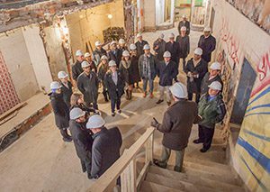 Developers survey a historic building and learn how to finance and manage historic building projects.