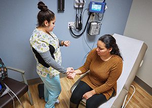 Health care worker with a female patient