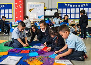 Children play with toys in a classroom
