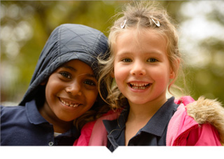 Two charter elementary schools of different races play together