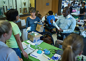 Health center staff hand out medications to wildfire victims.