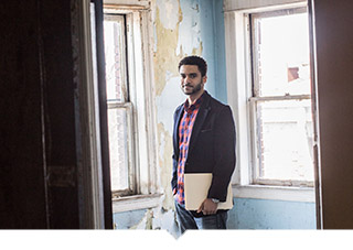 Man stands in room about to be renovated