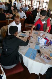 Ideation takes place at a table.