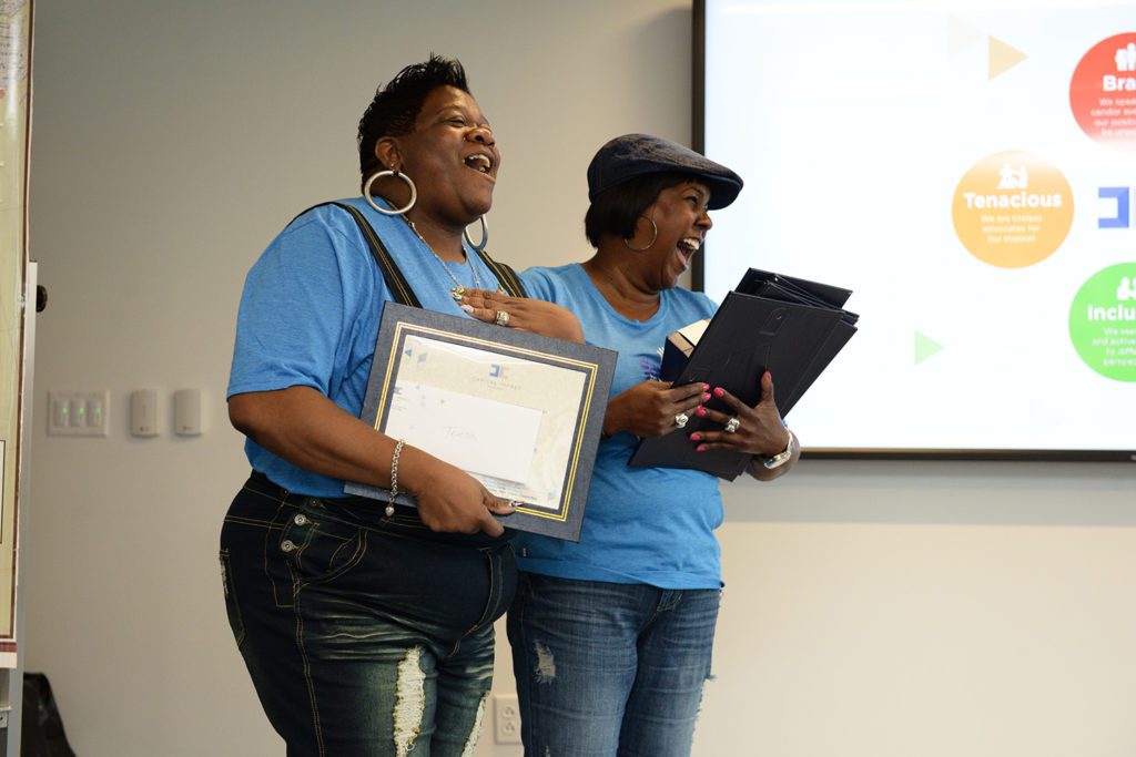 Staff hand out and receive awards based on Capital Impact values