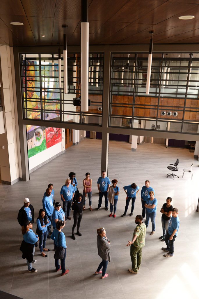 Capital Impact staff stand in the Martha's Table atrium