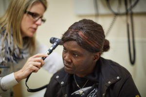 Woman receives care from doctor