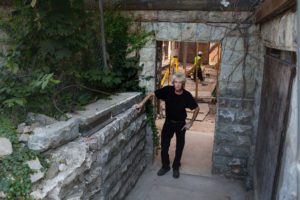 Joel Landy in Scott Mansion hallway