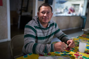 Man sits in farmworker center
