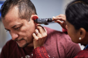 A man receives health care from a doctor