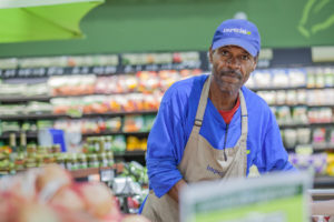 Black man working in grocery store