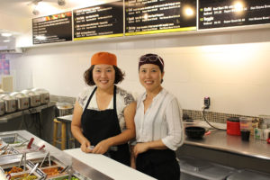 Two Korean women in their restaurant