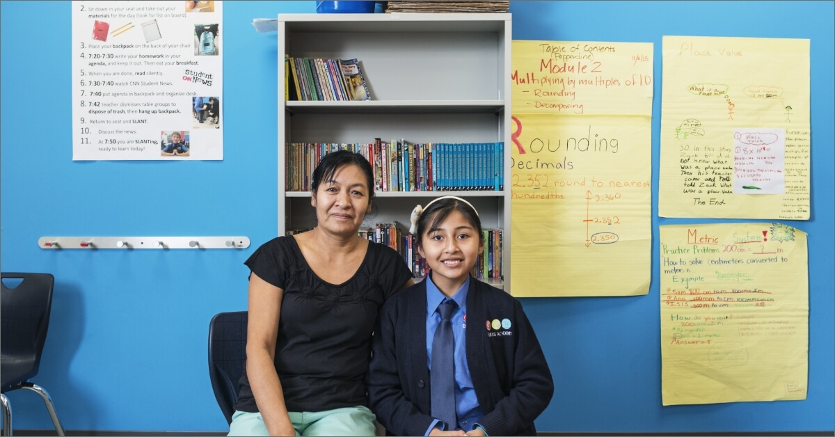 A child and an adult in a classroom. Funding from Capital Impact Investment Notes helps expand Capital Impact Partners' national footprint through organizations that provide access to critical social services, including health care, education, healthy foods, affordable housing, cooperatives, and dignified aging facilities.