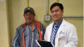 Ole health doctor meets with patient at health fair