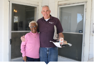 Meals on Wheels volunteer delivers food to a neighbor