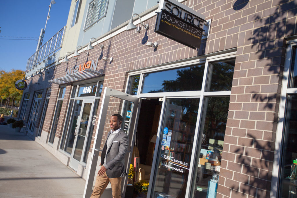Man walks out of Source Booksellers, located in the Auburn
