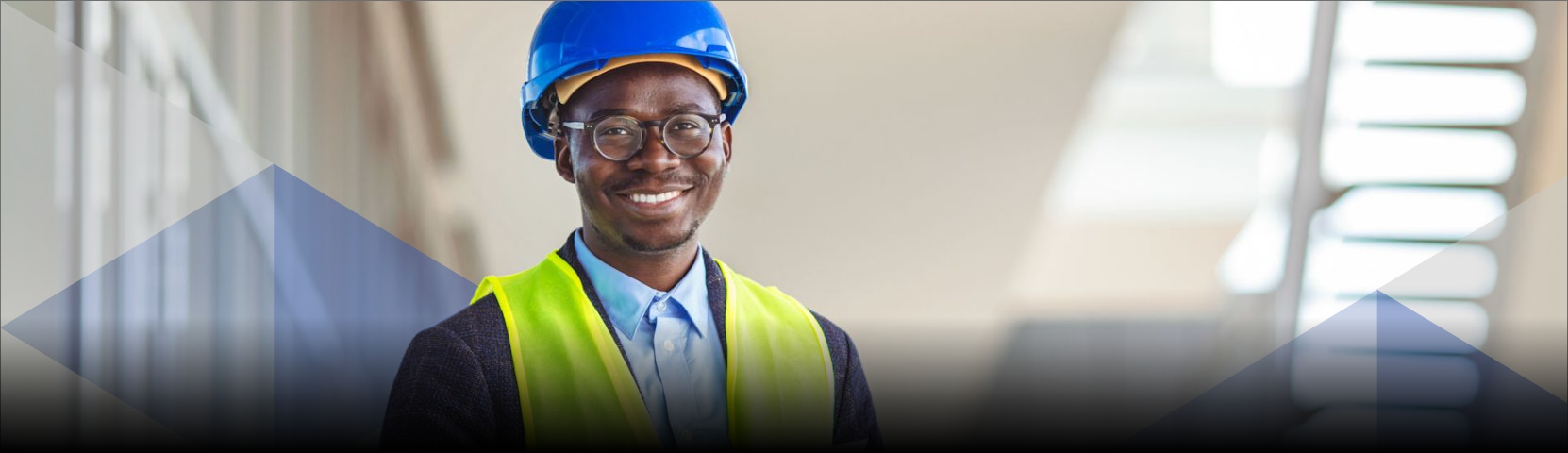 Man wears hard hat at a construction site.