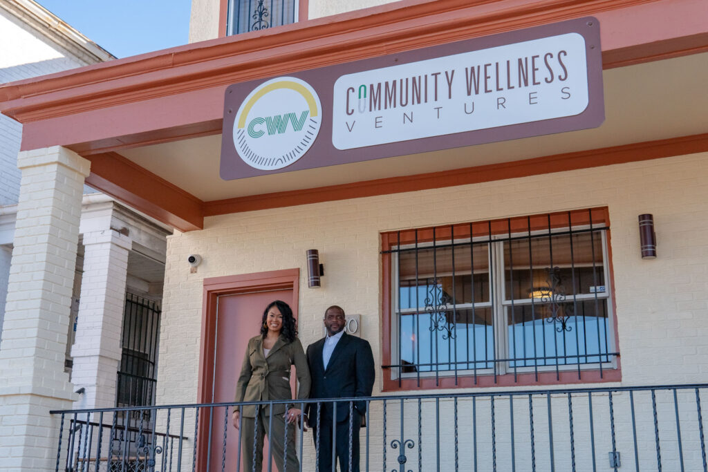 Dr. Charlayne Hayling-Williams and Dr. Rod Williams stand in front of Community Wellness Ventures