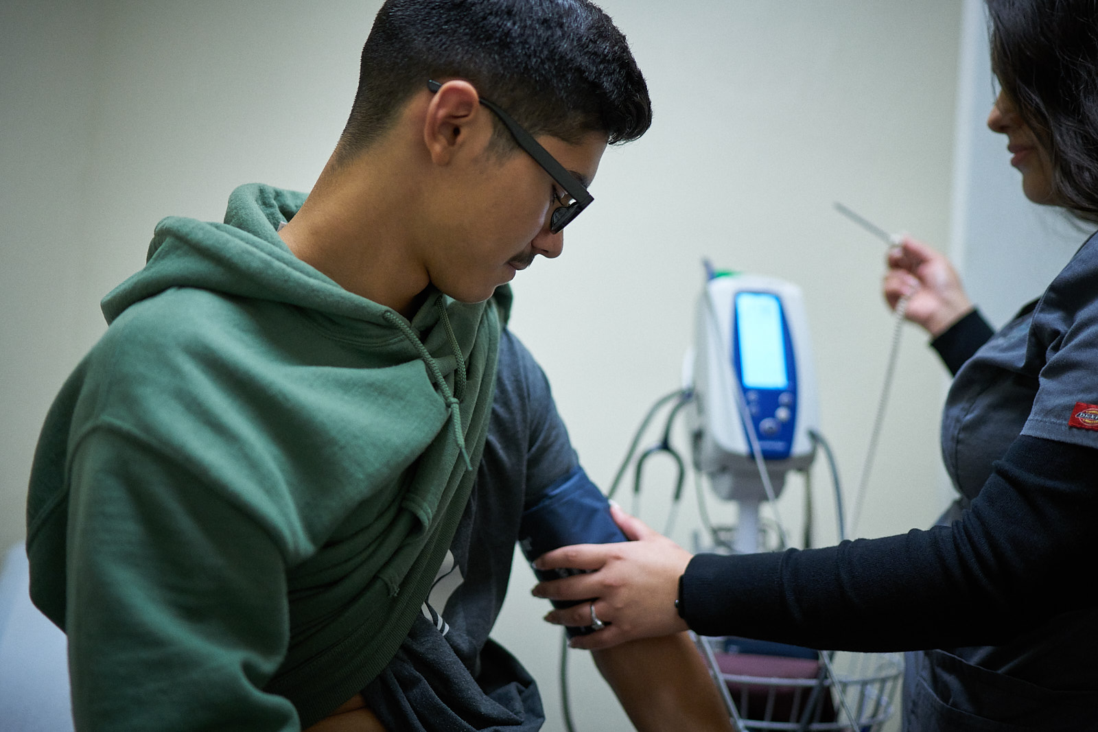 Patient being examined by nurse.