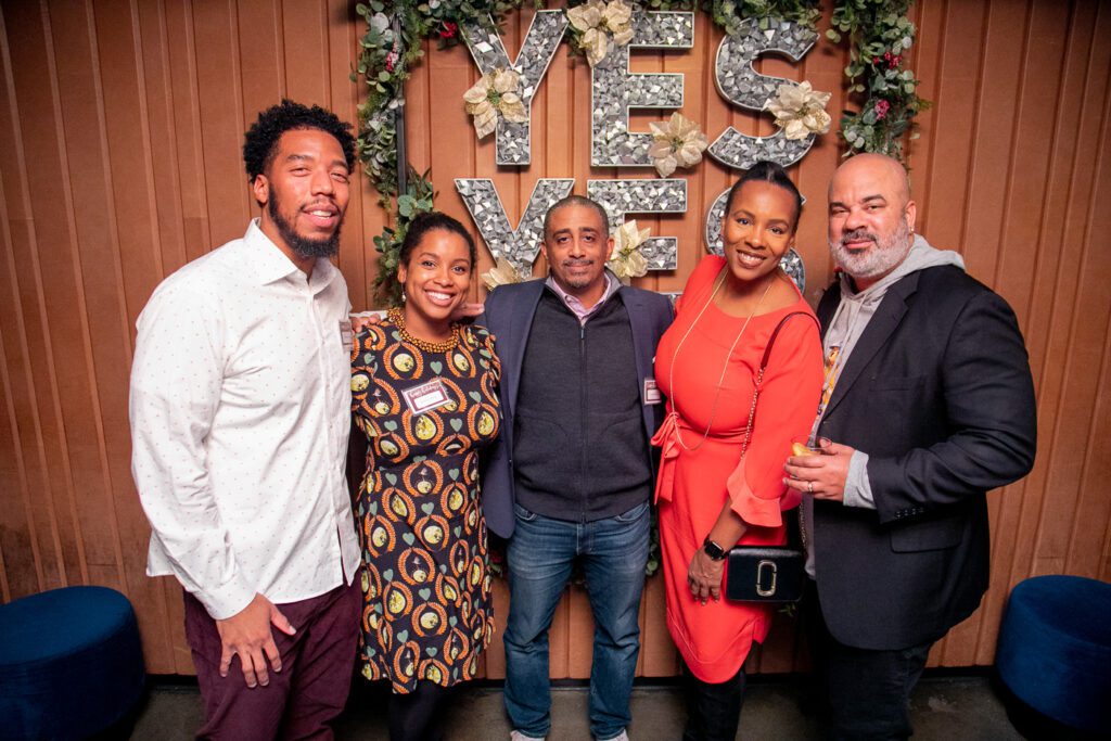 Group shot of HEAF participant Ronette "Ronnie" Slamin, founder of Embolden Real Estate, surrounded by four others.