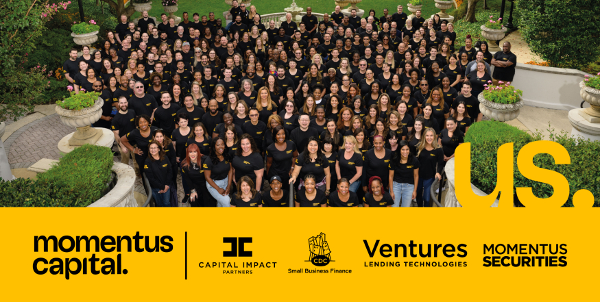 All Momentus Capital employees in a large overhead group shot