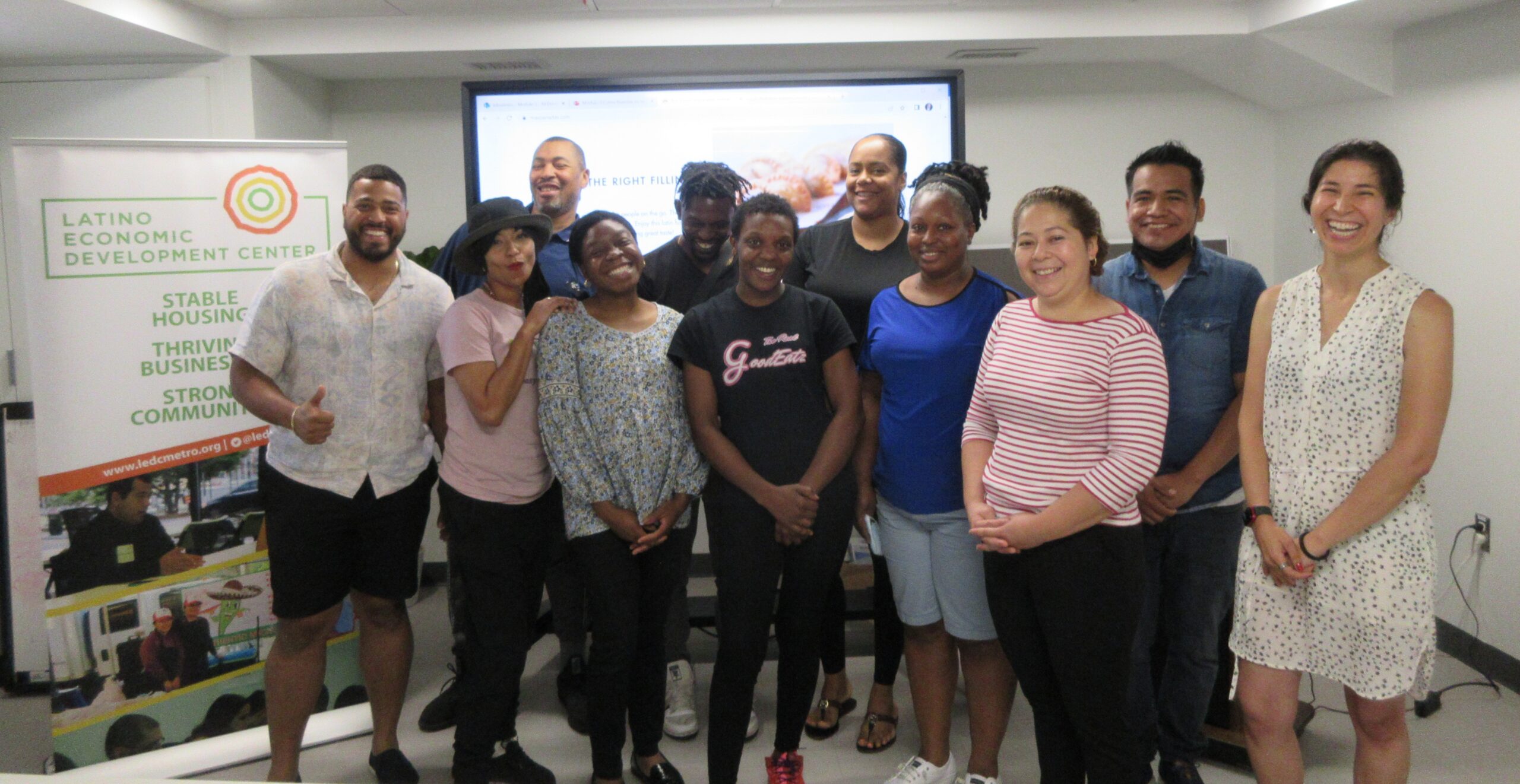 Photo showing group of food entrepreneurs smiling during a training session