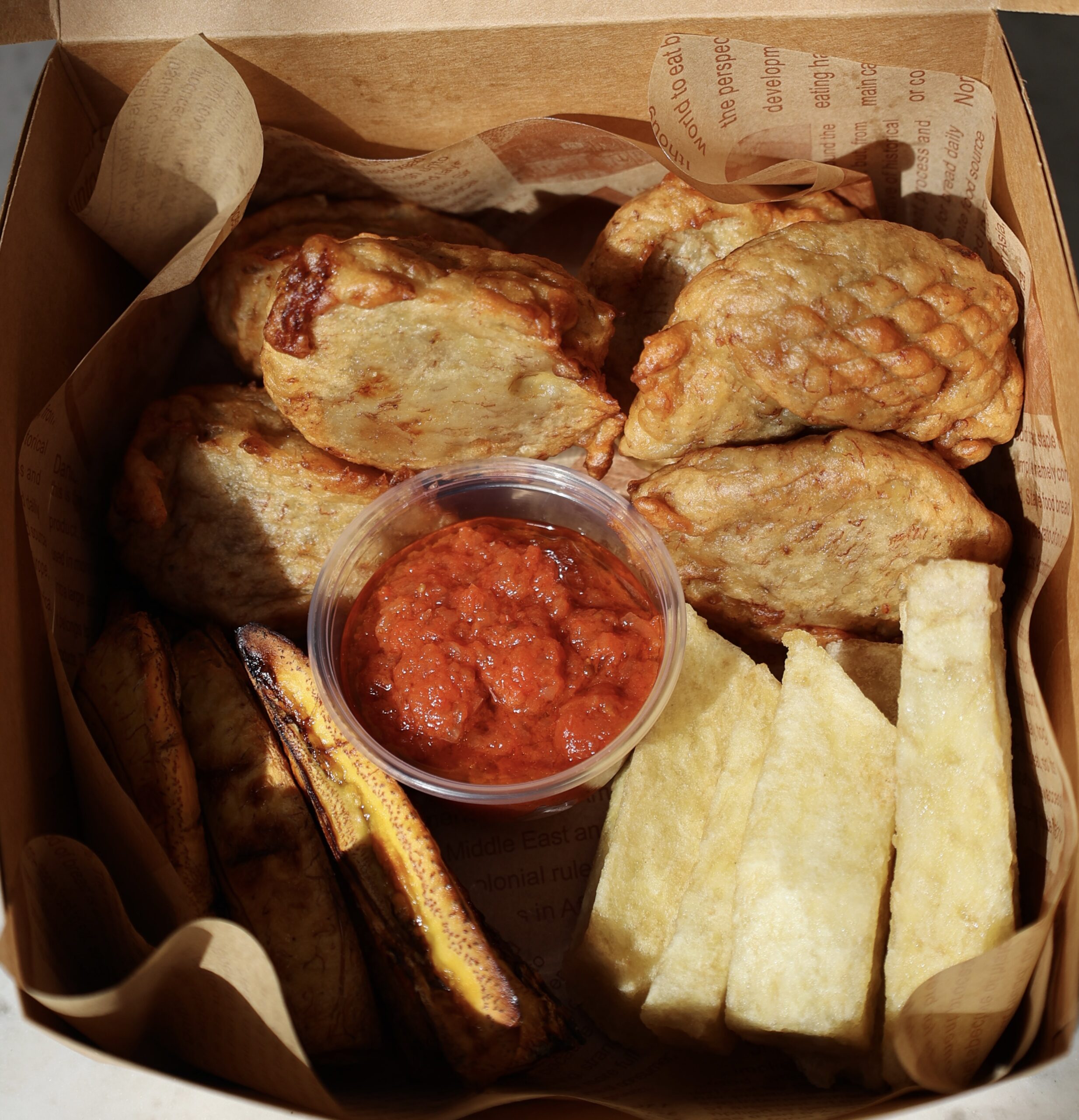 Photo of authentic Nigerian finger foods in a box.
