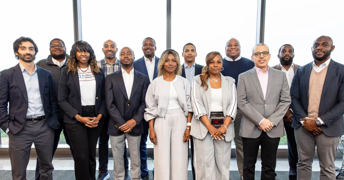 Capital Impact Partners' 2026 Amazon Housing Accelerator Fellowship participants gather together.